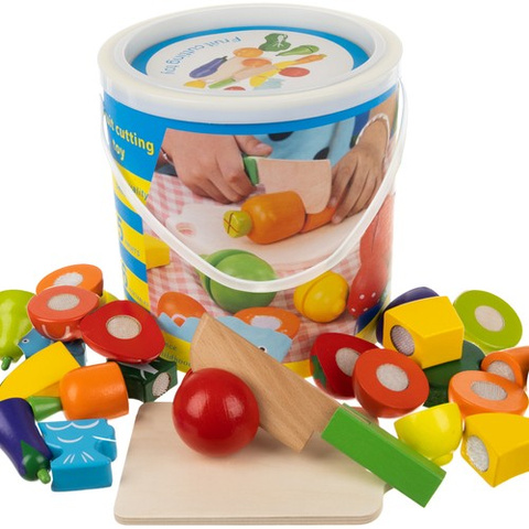 Wooden chopping vegetables in a bucket