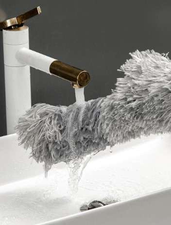 Telescopic dust brush with two attachments