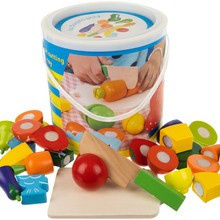 Wooden chopping vegetables in a bucket