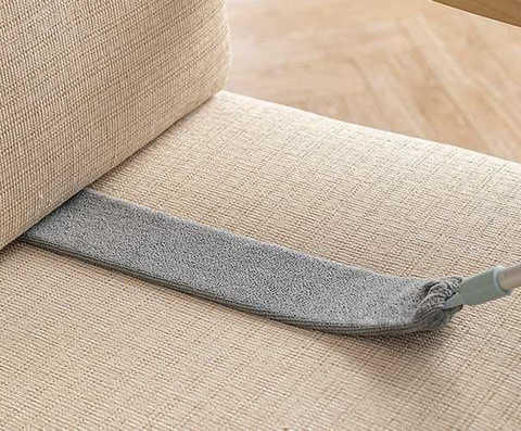 Telescopic dust brush with two attachments