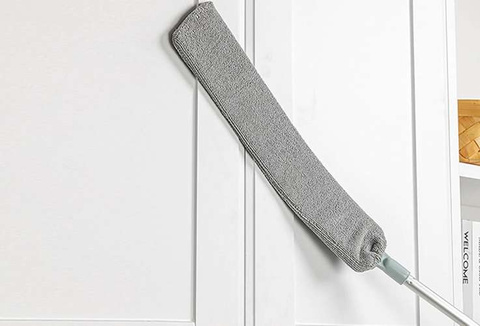 Telescopic dust brush with two attachments